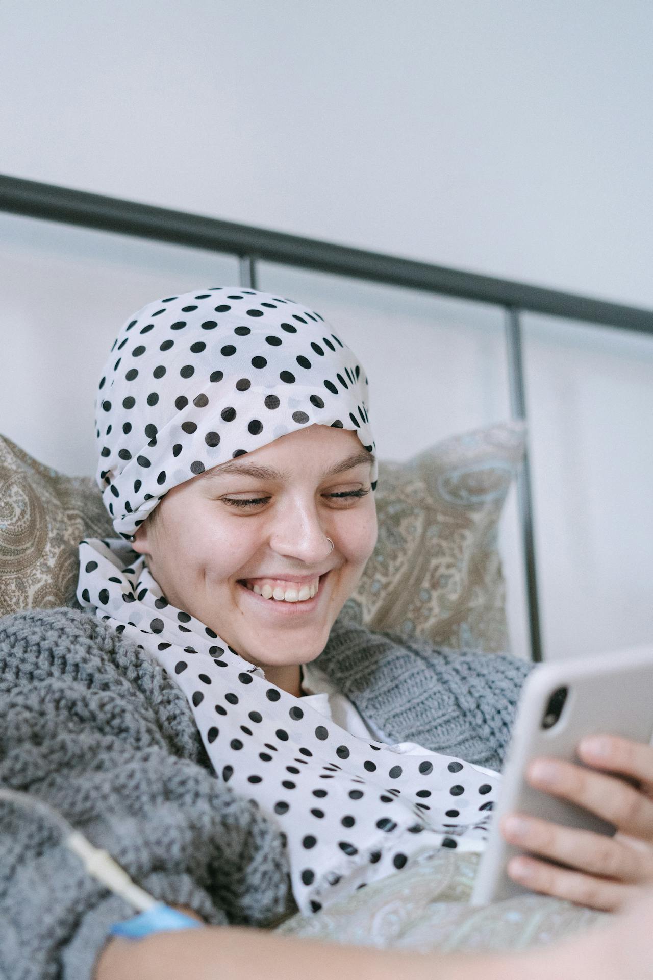 A smiling person connecting with support by phone
